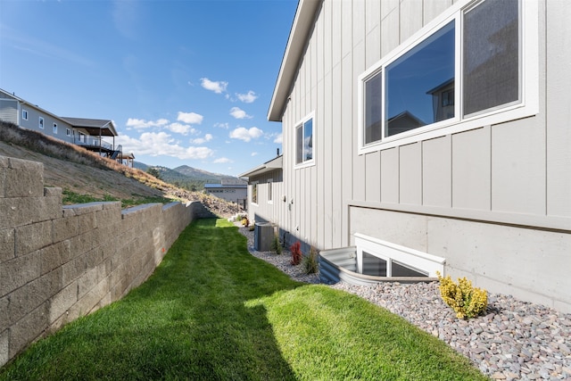 view of yard with a mountain view and central AC