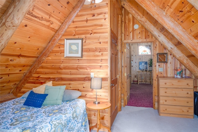 bedroom featuring vaulted ceiling with beams, wooden walls, carpet floors, and wooden ceiling