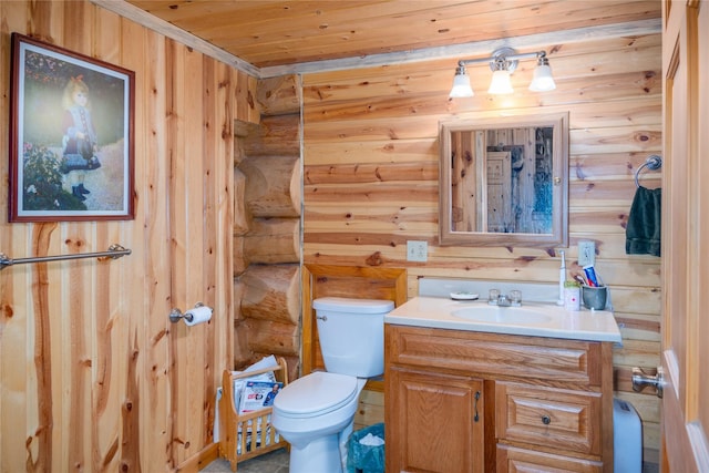 bathroom with vanity, wooden walls, toilet, and wooden ceiling