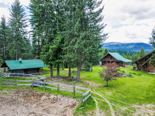 view of yard featuring a mountain view and an outbuilding