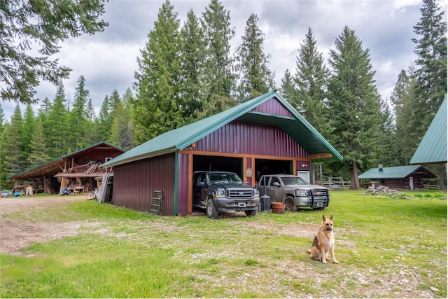 garage featuring a lawn