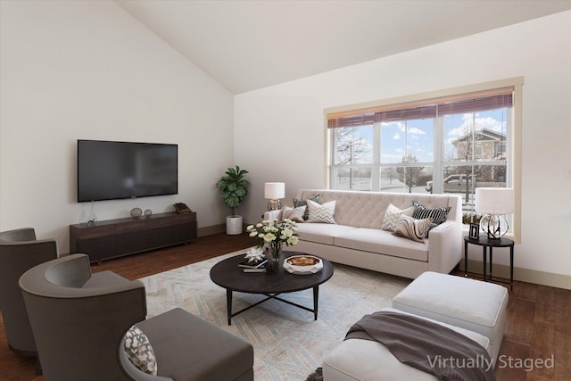 living room with lofted ceiling, baseboards, and wood finished floors