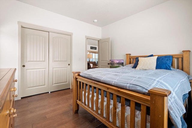 bedroom with a closet and wood finished floors