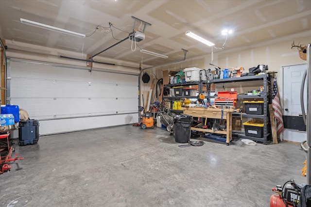 garage featuring a workshop area and a garage door opener