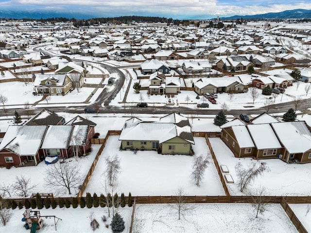 snowy aerial view with a residential view