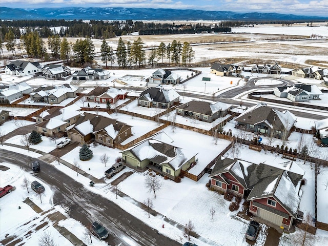 snowy aerial view featuring a residential view