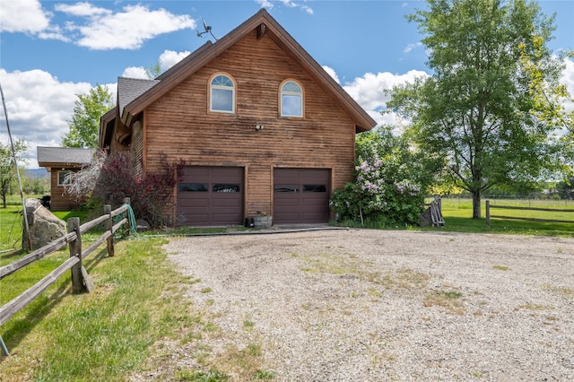 view of property exterior with a garage