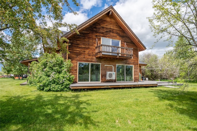 625 Middle Burnt Fork Rd, Stevensville, MT 59870 - rear view of property featuring a balcony, a lawn, and a wooden deck