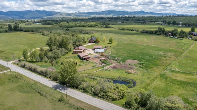 drone / aerial view with a mountain view and a rural view