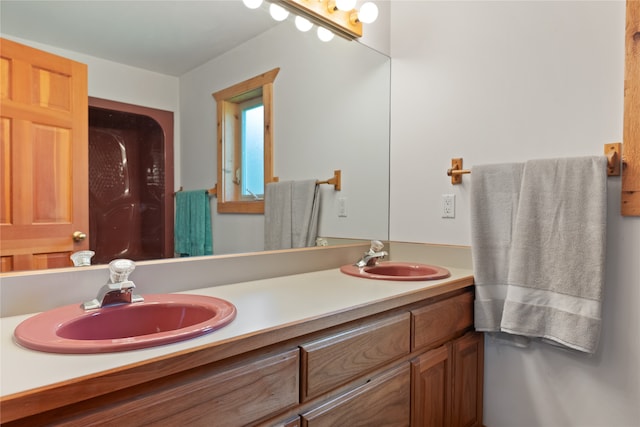 bathroom featuring double vanity