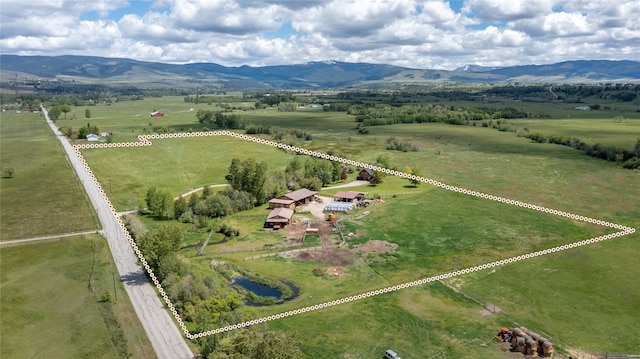 bird's eye view featuring a rural view and a mountain view