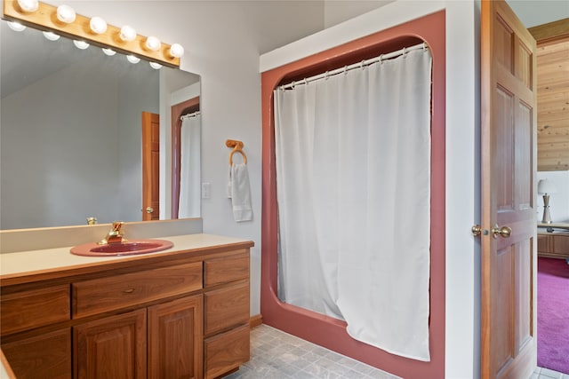 bathroom featuring tile flooring and vanity