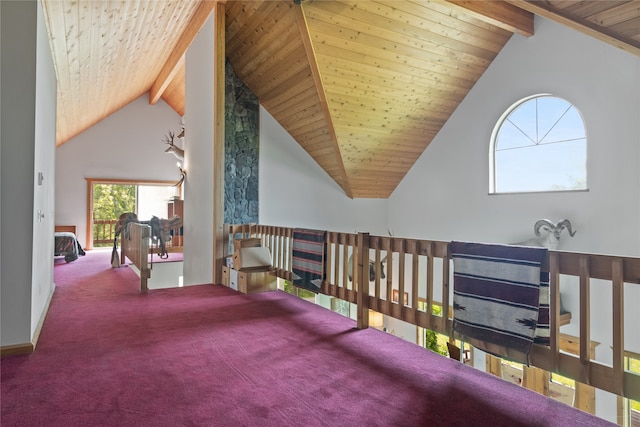 hall with high vaulted ceiling, carpet, beam ceiling, and wood ceiling