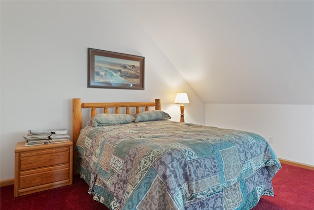 bedroom featuring carpet floors and vaulted ceiling