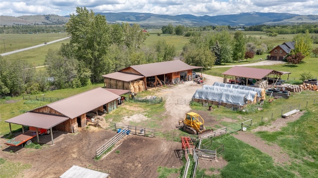 drone / aerial view featuring a mountain view and a rural view