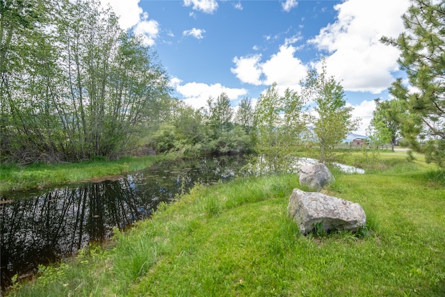 view of yard with a water view