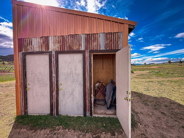 view of outbuilding with a yard