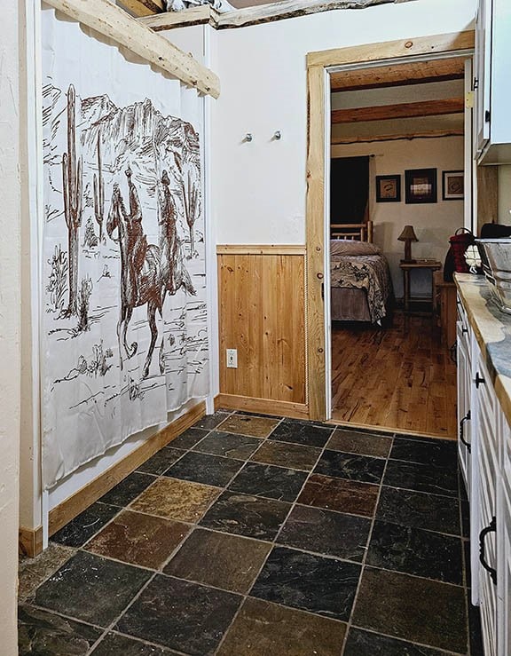 entryway featuring dark tile patterned flooring