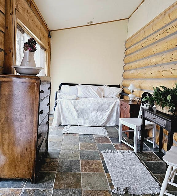 bedroom with dark tile patterned floors