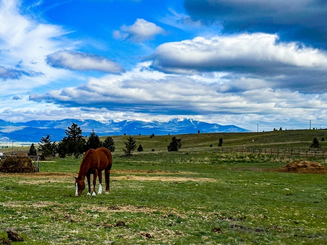 property view of mountains featuring a rural view