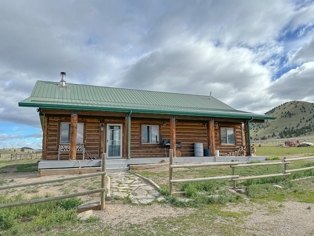 log home featuring a porch