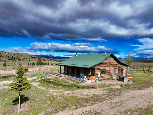 view of front of property with a rural view