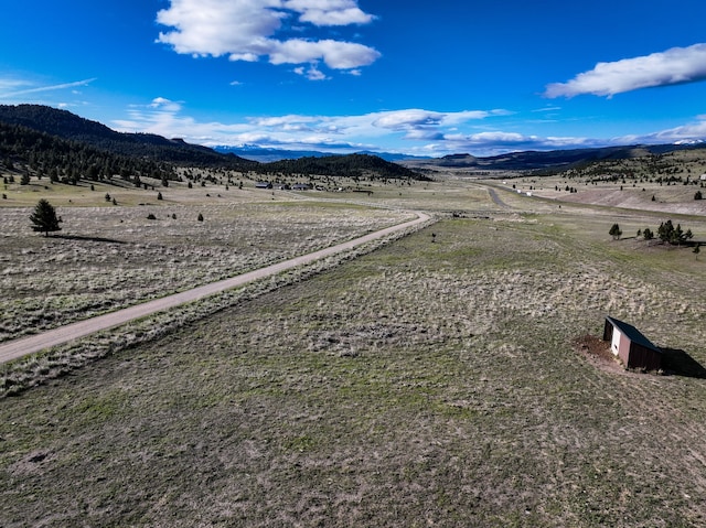 aerial view featuring a mountain view and a rural view