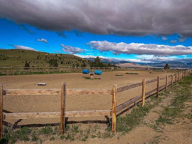 view of yard featuring a mountain view and a rural view