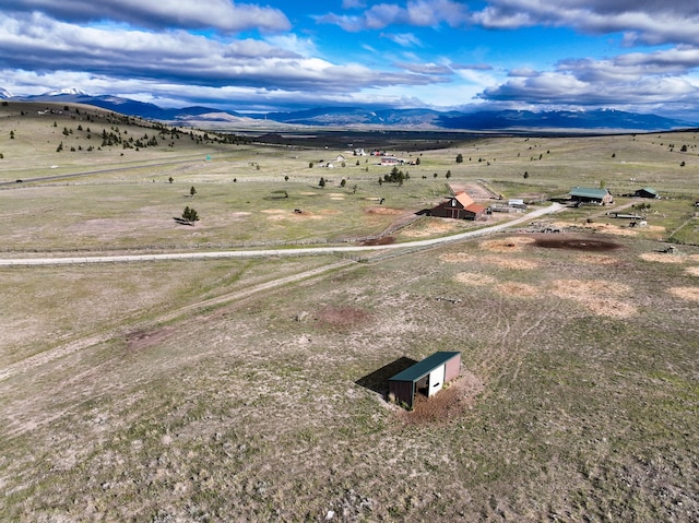 aerial view with a mountain view and a rural view