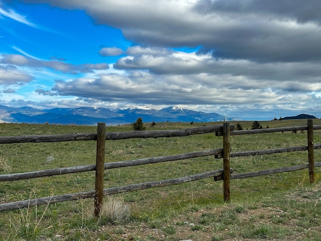 view of gate featuring a mountain view and a rural view