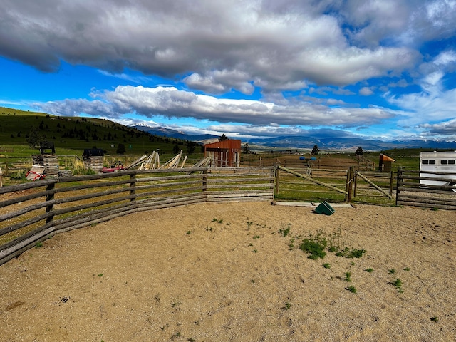 view of yard featuring a mountain view and a rural view