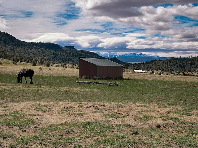 mountain view featuring a rural view