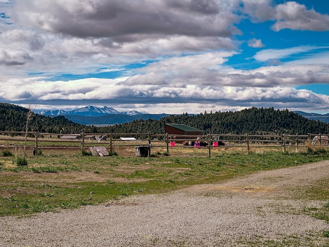 property view of mountains featuring a rural view