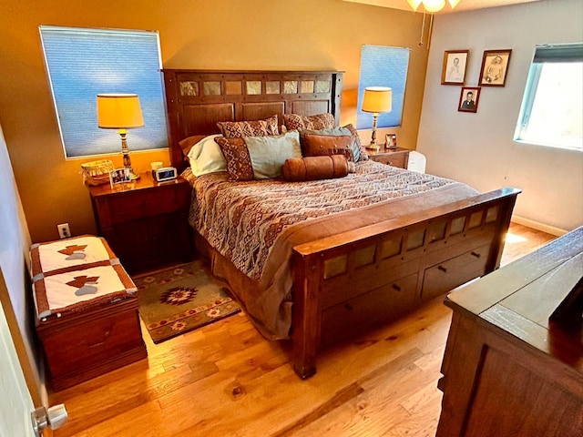 bedroom with light hardwood / wood-style floors