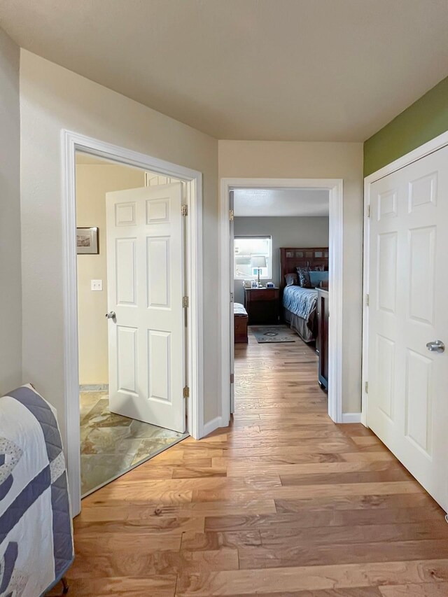 bathroom featuring ceiling fan, wood-type flooring, and vanity