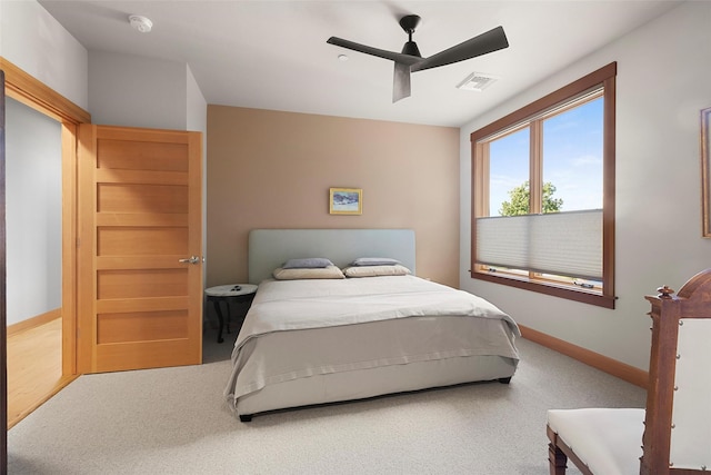 carpeted bedroom featuring ceiling fan