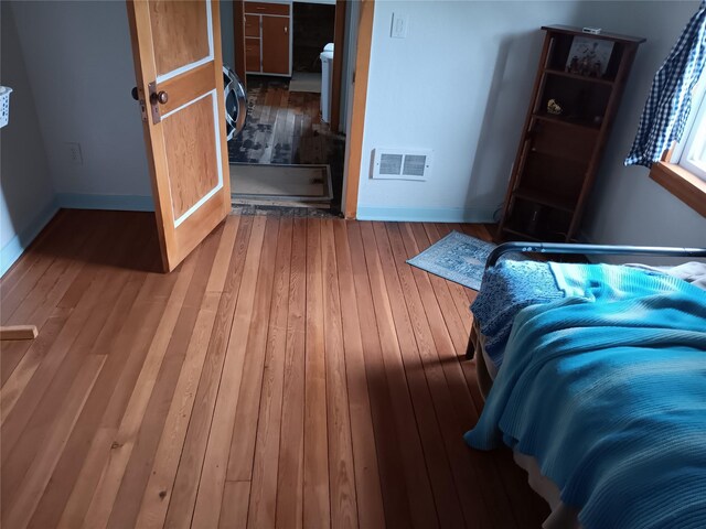 bedroom featuring hardwood / wood-style flooring