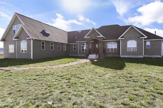 single story home featuring a front yard