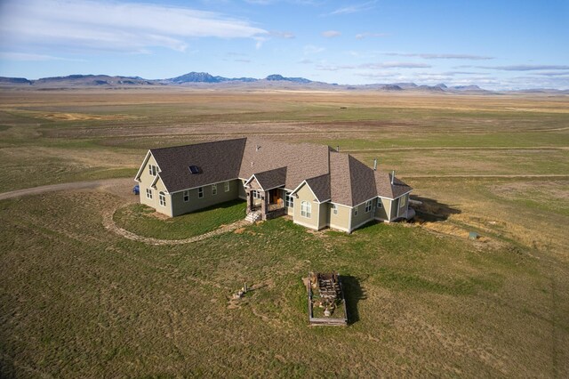 birds eye view of property with a rural view