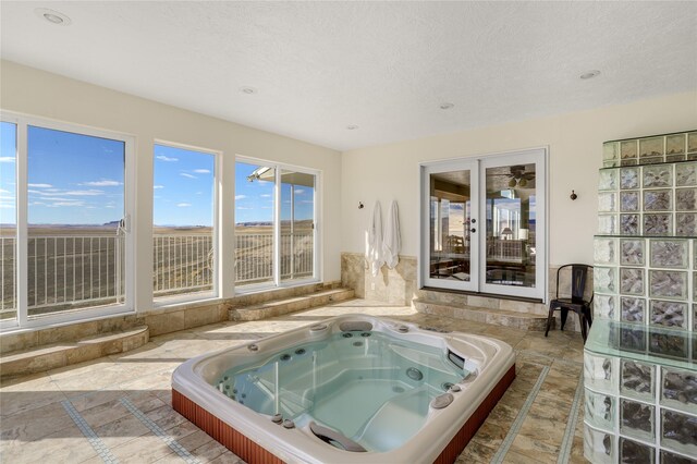 bathroom featuring tile flooring and a textured ceiling