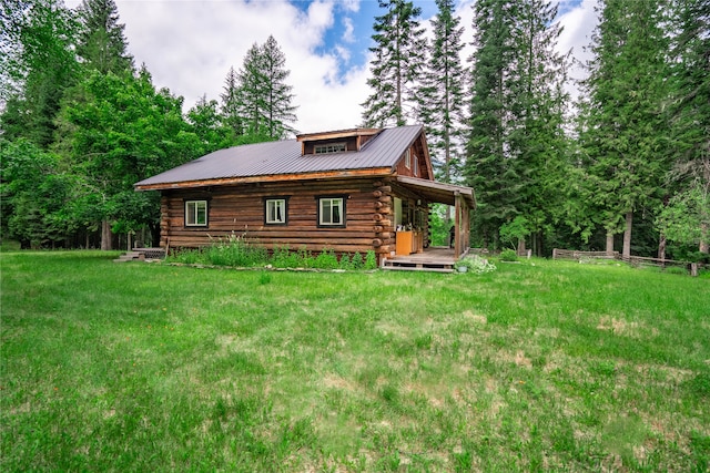 rear view of house with a yard