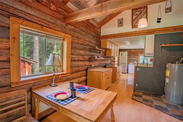 dining area featuring lofted ceiling with beams, wooden ceiling, electric water heater, and light wood-style floors