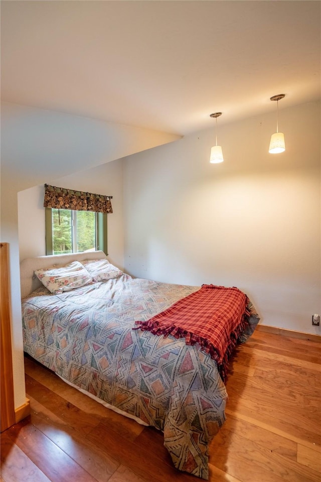 bedroom with wood finished floors