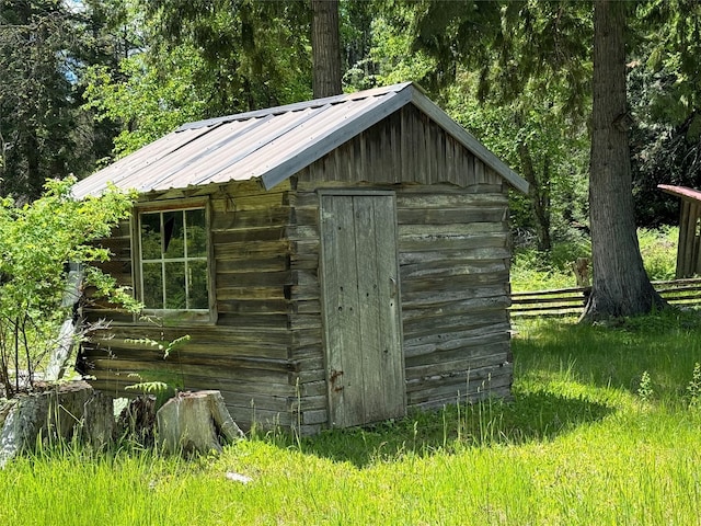 view of shed with fence