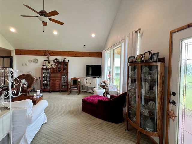 carpeted living room featuring ceiling fan and high vaulted ceiling