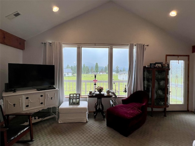 living room with carpet floors and vaulted ceiling