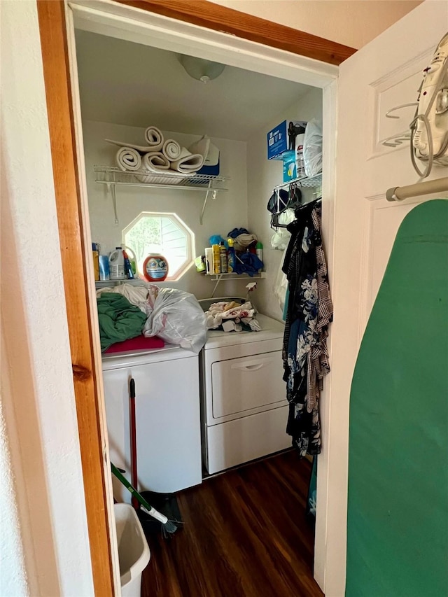 washroom with washer and dryer and dark hardwood / wood-style floors