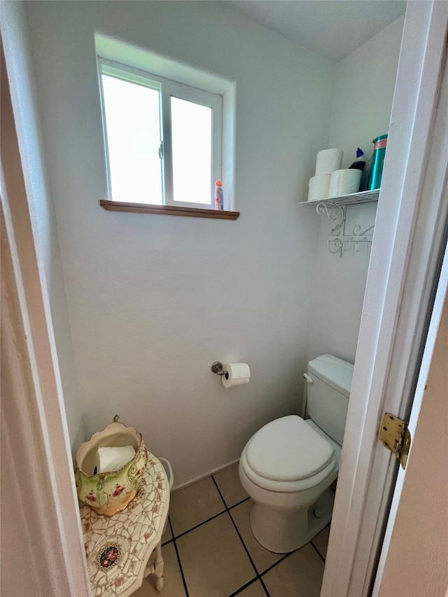 bathroom featuring toilet and tile patterned floors