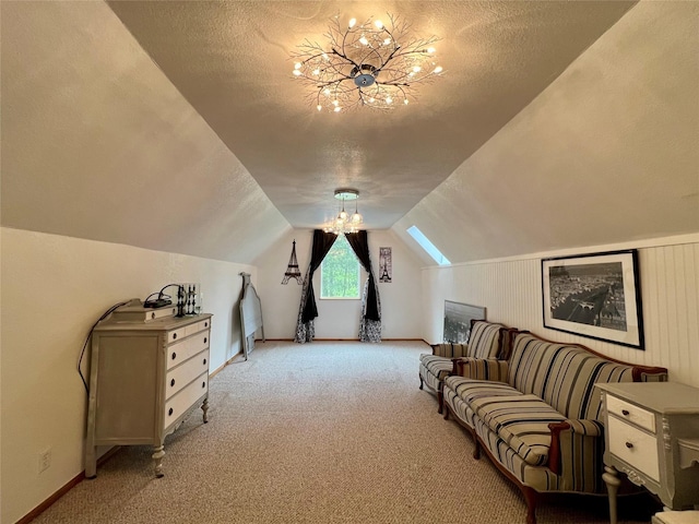 interior space with light colored carpet, a textured ceiling, a chandelier, and vaulted ceiling