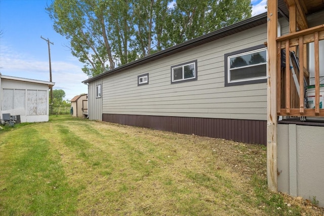 view of side of property with a lawn